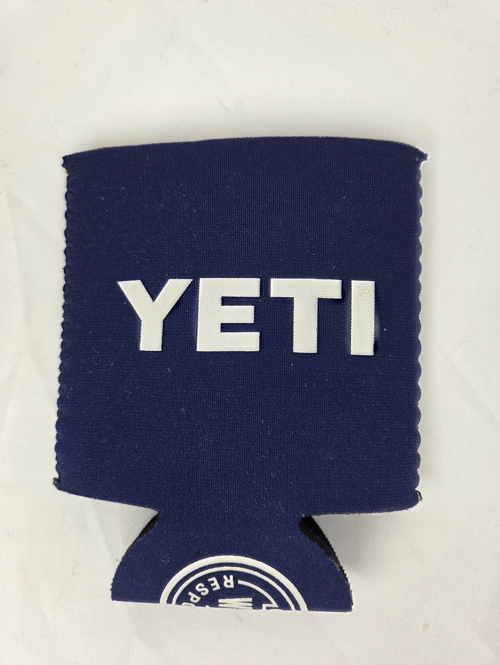 Yeti Navy Blue Can Cooler with White 'Built for the Wild' Print